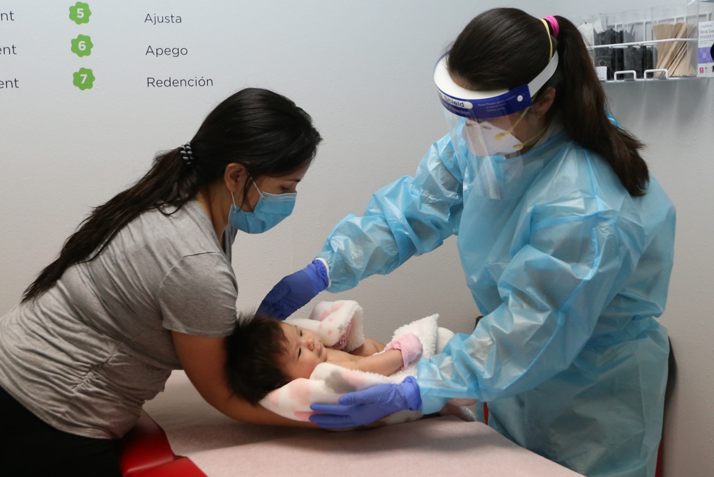 Doctor examining baby